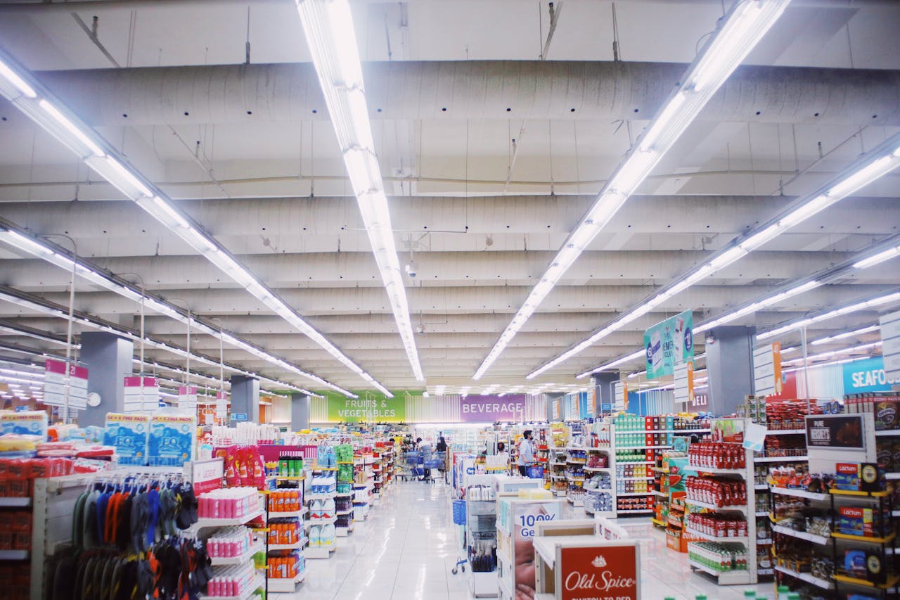 services-01 Interior of modern supermarket with various shelves with assorted colorful products under bright lamps
